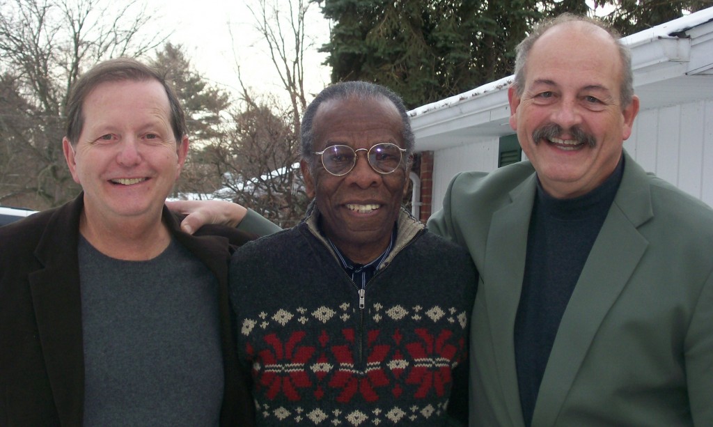 Ron Primeau, left, Herb Martin, and David Schock enjoy a post premier moment